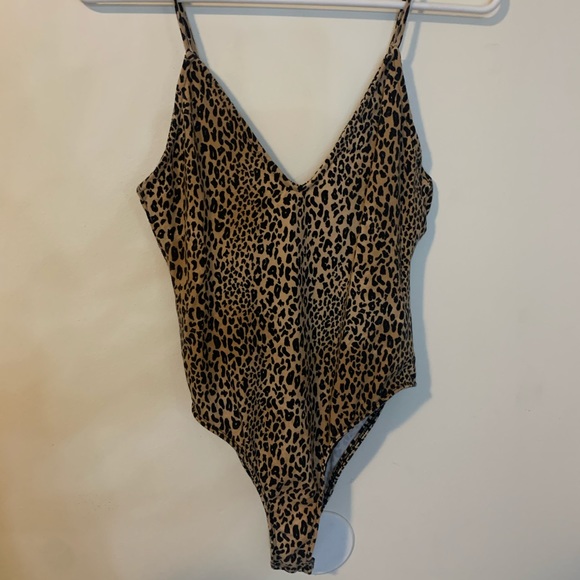 Forever 21 Tops - Cheetah print cross back body suit from Forever 21.